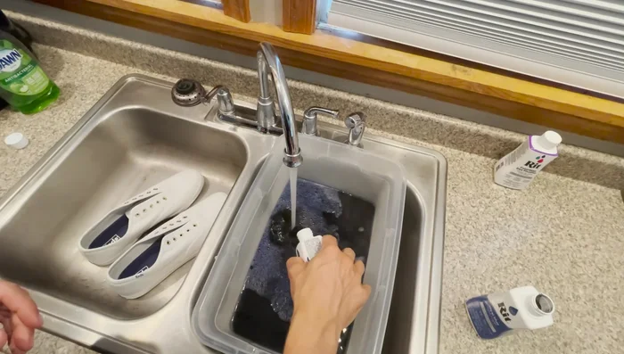 Prepare dye bath: Mix fabric dye according to instructions. The video uses one-half bottle each of two colors for approximately one and a half gallons of water. Add a small amount of dish soap.