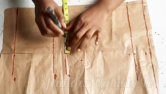 Mark half your shoulder measurement on the chest line.