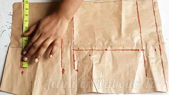 On the waistline, mark waist measurement / 4 + 1 inch.