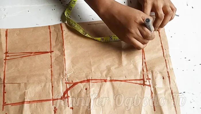 Extend the neckline by 1.5 inches, then curve inward by 0.5 inches for a narrower neckline.