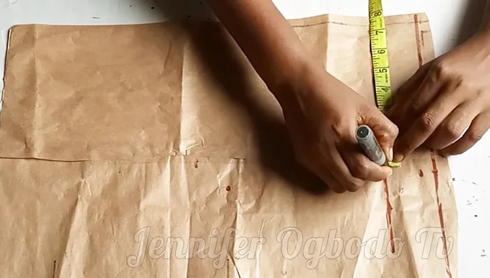 Mark half your shoulder measurement on the chest line.