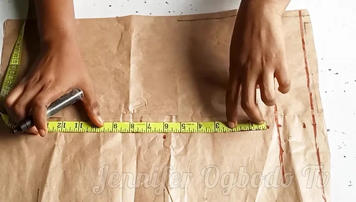 Mark half your shoulder measurement on the chest line.