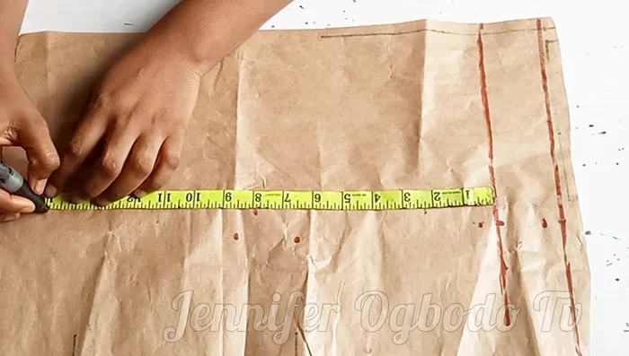 Mark the desired jacket length (e.g., 15 inches) on the starting line.