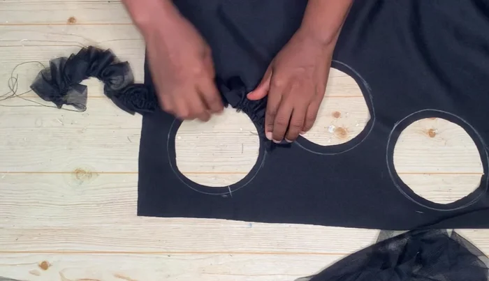 Sew the gathered ruffles around each circle on the front piece (Note: It's more efficient to sew the ruffles *before* cutting out the circles).