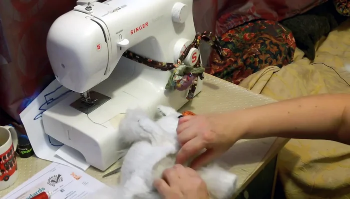 Close the opening in the unicorn's head, carefully securing the seam and incorporating any loose hair or fur. Hand stitch or use a sewing machine.
