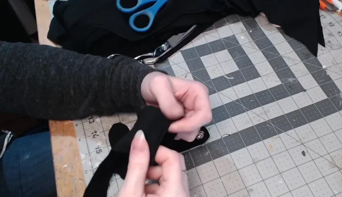 Finish the wrist edge with a quick hem or rolled hem.