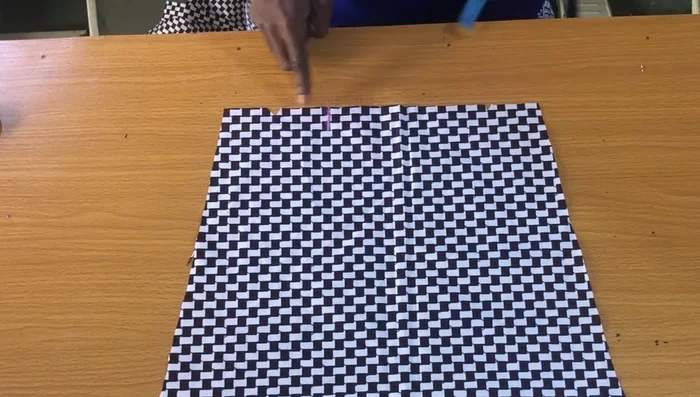 Attach the placket to the larger side of the slit, aligning the bottom with the sleeve bottom, and stitch.