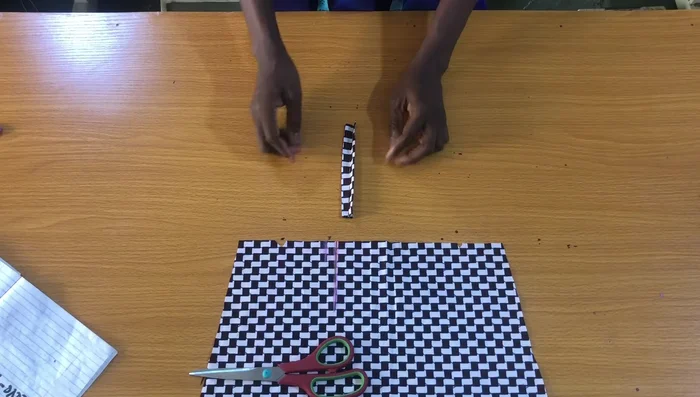 Attach the placket to the larger side of the slit, aligning the bottom with the sleeve bottom, and stitch.