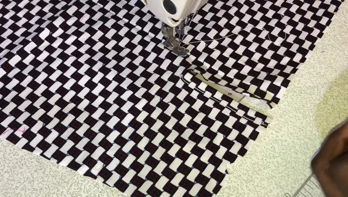 Attach the placket to the larger side of the slit, aligning the bottom with the sleeve bottom, and stitch.