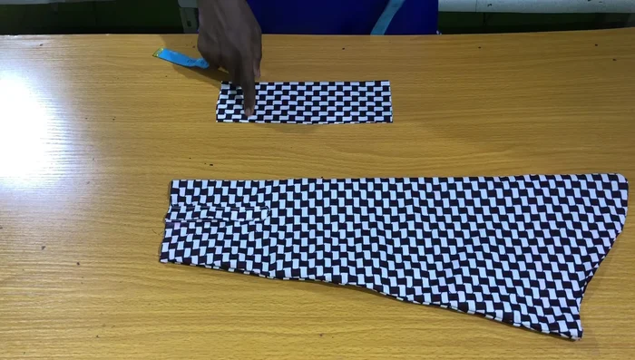 Close the band opening. Attach buttons and buttonholes (buttons on the band, buttonholes on the placket). Attach sleeves to the armholes.