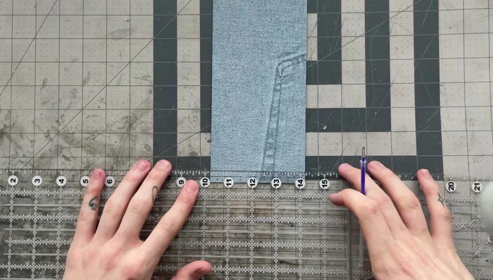 Prepare fabric edges: Mark ½ inch from the edge on the wrong side of the fabric. Apply glue within this area and fold the edges up to the lines, creating a ¼-inch fold.