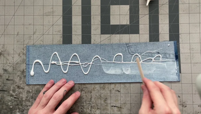Create the handle base: Apply glue to the wrong side and fold the strip in half again, ensuring all edges line up perfectly.