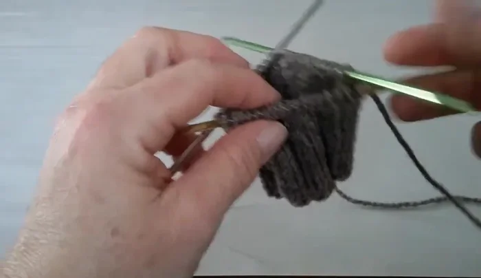 Place a marker on needle three, then slide two stitches from your working needle onto needle three.