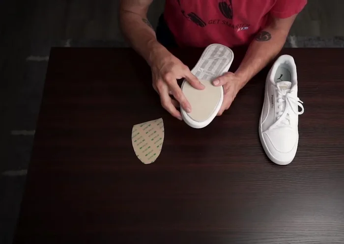 Apply the leather soles: Carefully peel and apply the leather stencils to the soles of your shoes, pressing firmly and slowly to avoid air bubbles. Focus on adhering the middle first, then working outwards.