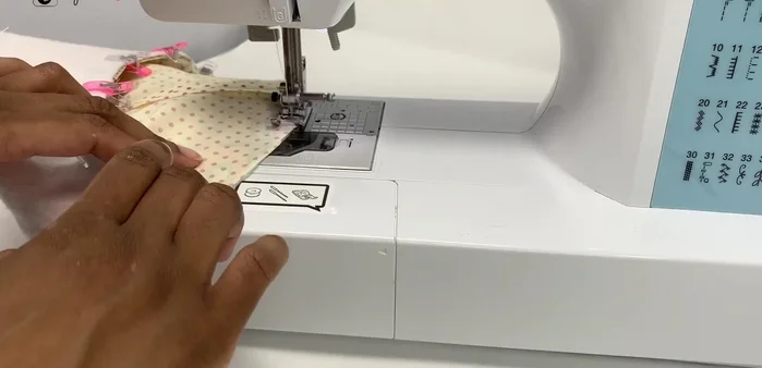 Top stitch along the edge and close the gap in the lining. Give the storage pot a final press.