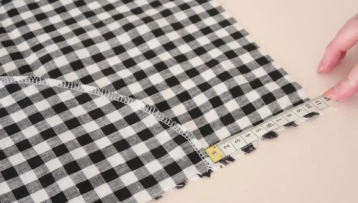 Stitch the main skirt pieces together at the side seams, enclosing the pockets.