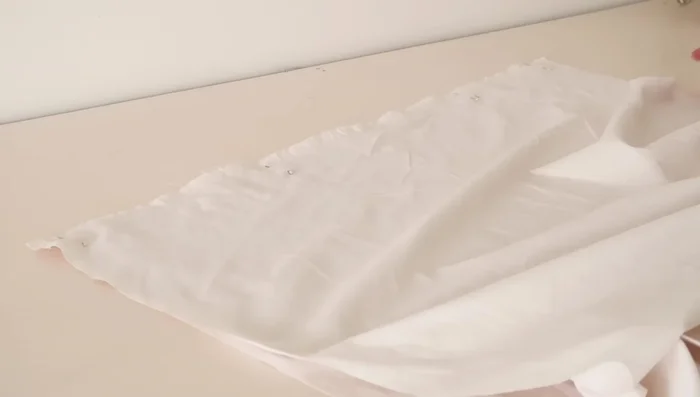 Hem one edge of the lining.