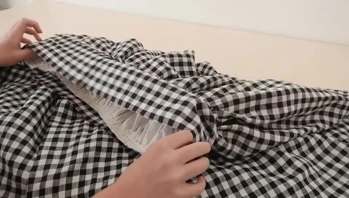 Stitch the waistband in place, enclosing the raw edges. Leave a small opening for elastic threading.