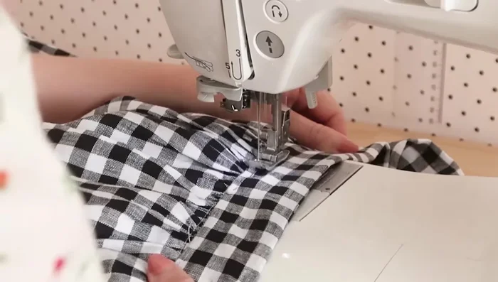 Stitch the waistband in place, enclosing the raw edges. Leave a small opening for elastic threading.