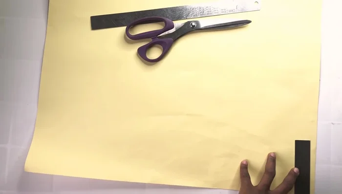 Fold the pattern in half, mark 2.5 inches at one edge and 3 inches at the other edge from the center point, then slant and cut out the pattern.