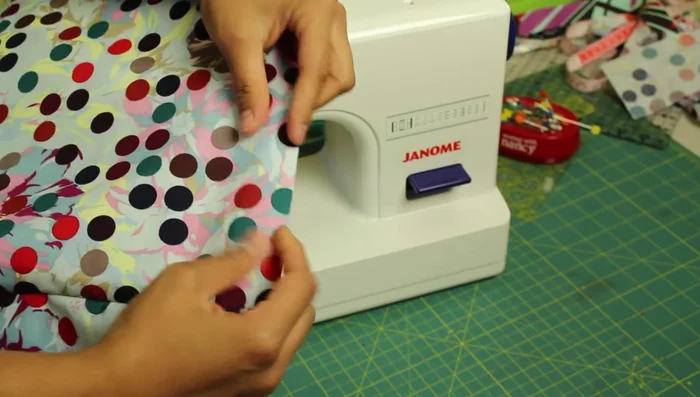 Finish the bottom edge: Choose a method to finish the bottom edge (bias tape, quilt binding, serging, hem, or zigzag stitch).