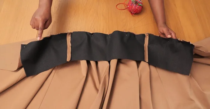 Attach waistband to the gathered outer skirt edges.