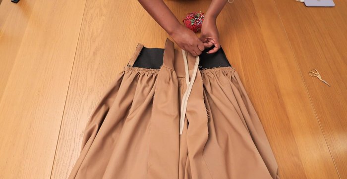 Sew invisible zip into the center back seam.