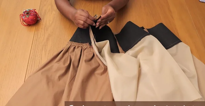 Pin and sew the lining to the skirt: Pin the center back edges, waistlines, and join lining and skirt with top stitching to finish the waistline edge neatly.