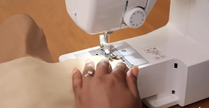 Sew close the bottom edge of the lining to conceal raw edges.