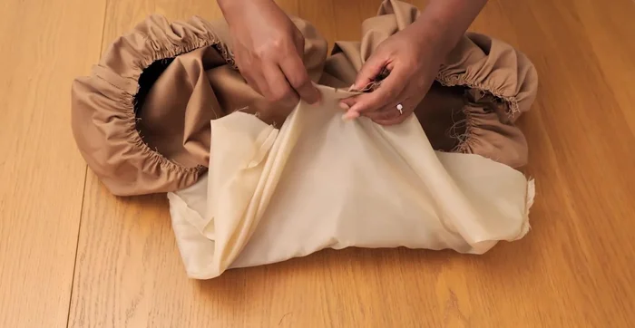 Join the lining hemline to the outer skirt hemline. Pull the gathers on the seam, pin, and stitch together.