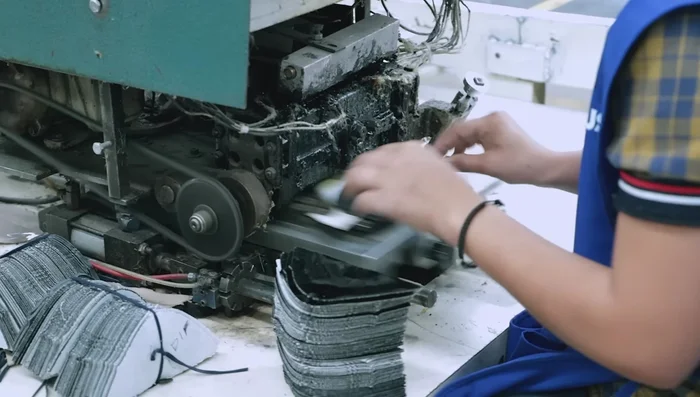 Upper Preparation: Gluing and reinforcing components of the shoe upper.