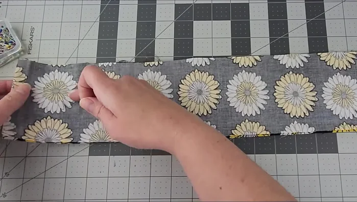 Turn the fabric right side out through the open end. Use a pencil or similar object to push out the corners.