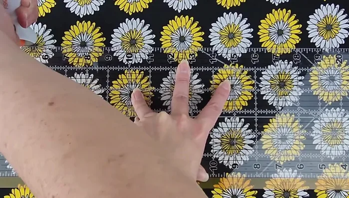 Cut fabric and fusible fleece pieces. Cut two 4-inch by 21-inch fabric pieces and one slightly smaller fusible fleece piece for each tieback.