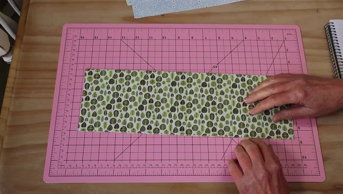 Mark 2.5cm (1 inch) dividers on the pocket fabric for pencil slots. Sew these lines, stitching back and forth at the beginning of each line for extra strength. Start stitching from the base and work upwards to prevent puckering.