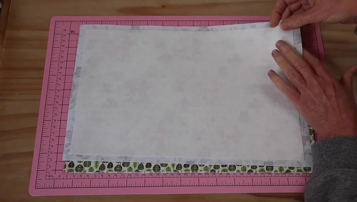 Place the lining fabric and wadding-backed outer fabric together, right sides facing. Pin or clip together, leaving an 8cm opening for turning. Sew around the edges, leaving the opening.