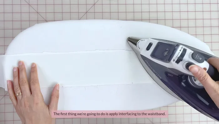 Stay stitch the seam allowances of one side of the waistband (about 1.2 cm from the edge). Fold seam allowances up to the wrong side and press.