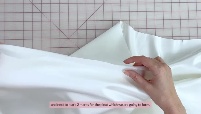 Finish the straight edge of the skirt by double folding and pressing before sewing.