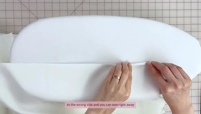 Finish the straight edge of the skirt by double folding and pressing before sewing.