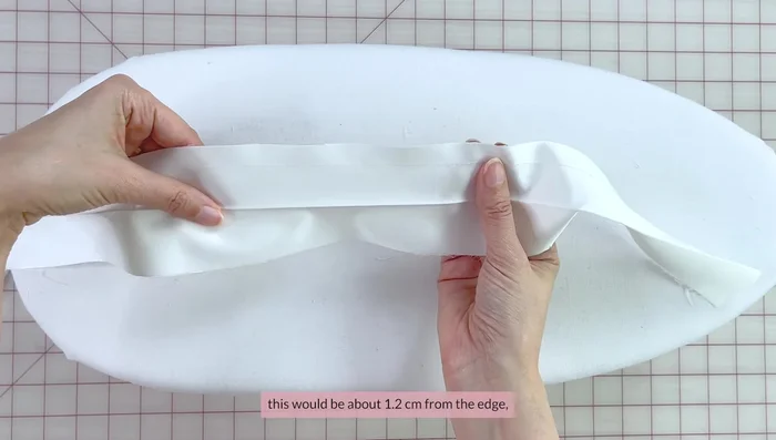 Stay stitch the seam allowances of one side of the waistband (about 1.2 cm from the edge). Fold seam allowances up to the wrong side and press.