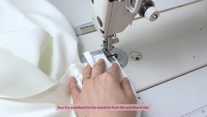 Sew the waistband to the skirt. Trim seam allowances to reduce bulk. Turn right side out and press.