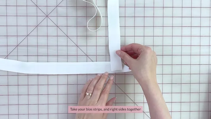 Pin ties to the waistband, measuring and positioning for desired length. Secure ties with small tacks.