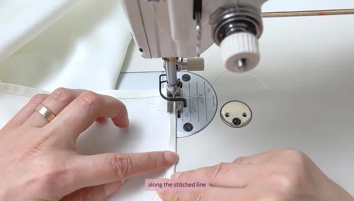 Create a baby hem by sewing, folding, and sewing again, close to the previous seams.