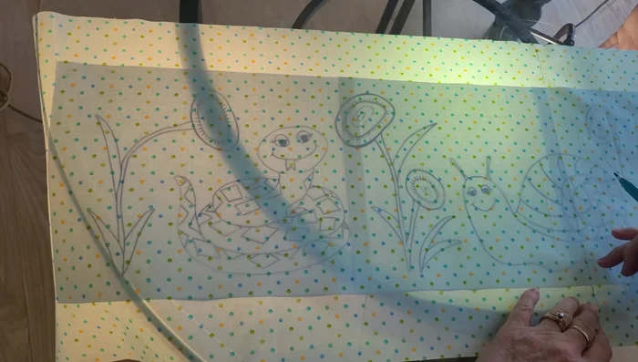 Separate two strands of floss and begin embroidering, using a running stitch to outline the design.