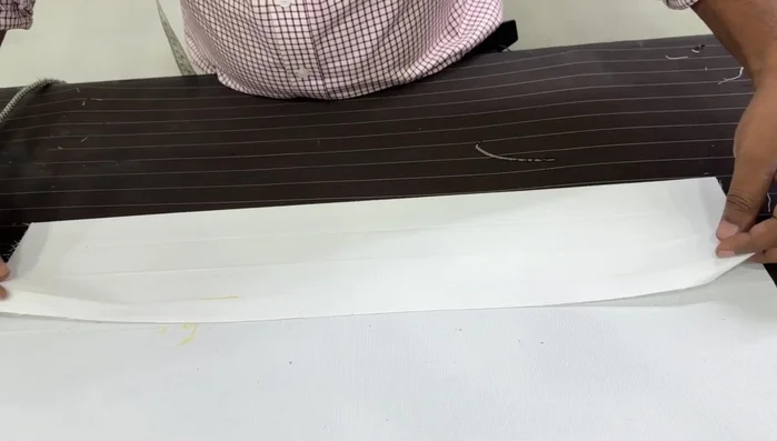 Mark and fold for the plate: Mark 1.5 inches above the top of the fly and 1.5 inches below the bottom of the fly. Fold and iron these sections to create the plate.