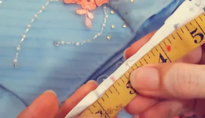 Sew the loops onto the zipper tape. Use tweezers to manipulate the loops if needed.