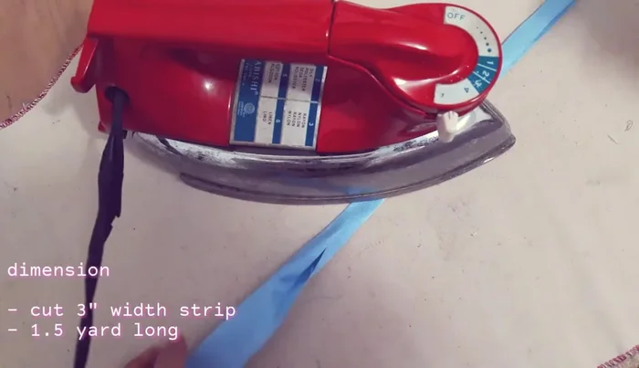 Cut 1.5 yards of fabric for the straps. Fold raw edges, then fold in half and press.