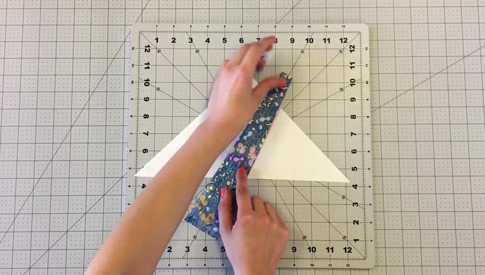 Repeat this process until the entire triangle is covered with strips.