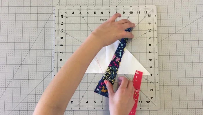Repeat this process until the entire triangle is covered with strips.