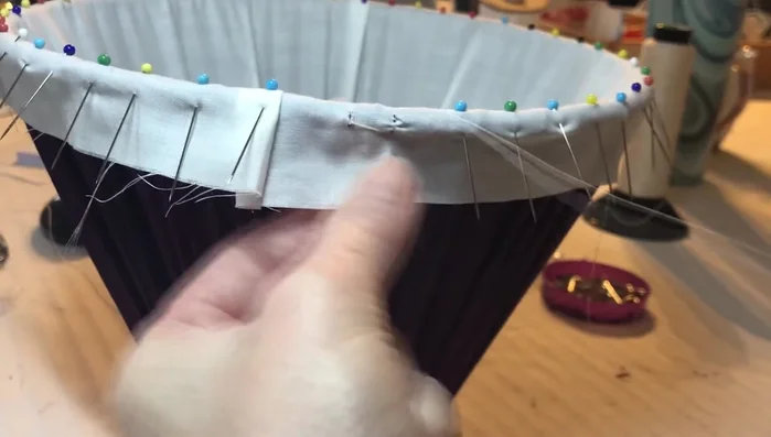 Continue working with a running zigzag and double securing back stitch, working a round of the frame. (Right-handed individuals might find it easier to work from left to right; left-handed individuals may prefer the opposite.)