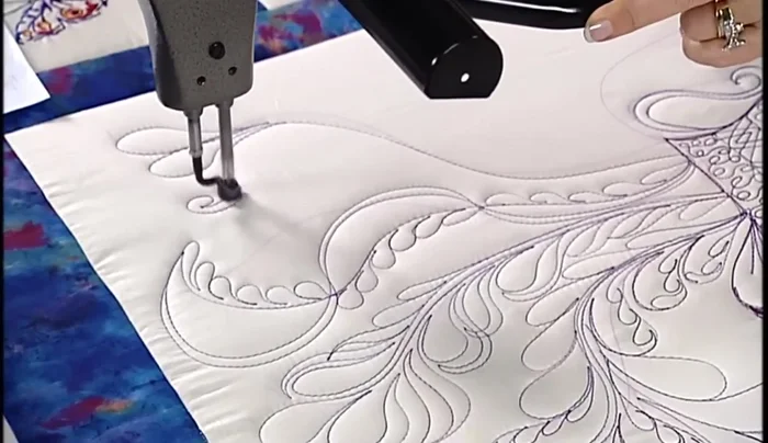 Stitch feathered curls: Create a regular feather then add a curl, forming a small bonnet-like shape.